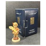 Hummel figurine titled "A Sweet Offering"