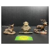 Metal deer and monkey figurines