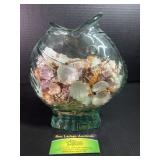 Fish bowl with sea shells