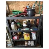Black Plastic Shelf with Garden Tools and More