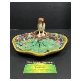 Plate with bird sitting on branches