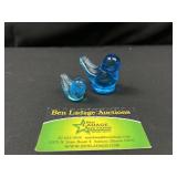 Two blue bird paperweights