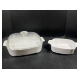 Two white Corning ware casserole dishes