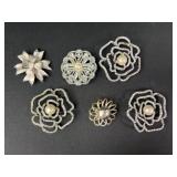 Floral brooches
