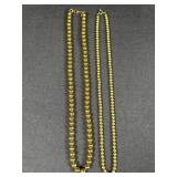 2 golden colored necklaces