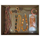 Orange and brown beaded necklaces and bracelets