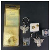Angel keychains, pins, and more