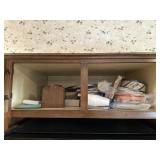 Paper goods and more above refrigerator