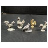 Tiny metal rooster and chickens