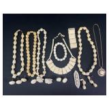 Carved necklaces, earrings, and more