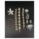 Swarovski brooch, Kramer earrings, and more