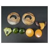 Bakelite earrings, dress clips, and belt buckles