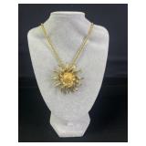 Kenneth J. Lane swirling sunburst pendant/brooch