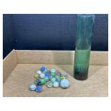 Marbles and glass container