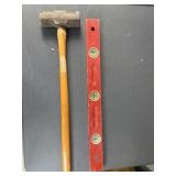 Sledge hammer and wooden level