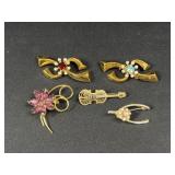 Gold tone brooches