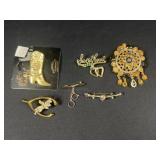 Gold tone brooches
