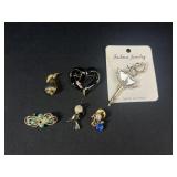 Gold toned brooches