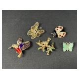 Butterfly, bird, and ladybug brooches