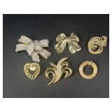 Gold tone brooches