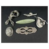 Silver tone brooches