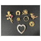 Gold tone brooches