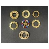 Gold tone round brooches