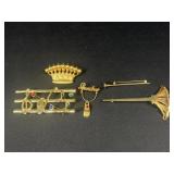 Gold tone brooches