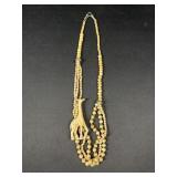 Carved giraffe and beaded necklace