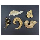 Gold tone brooches