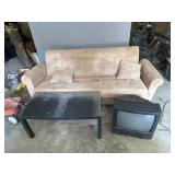 Futon Couch, Small Black Table, and TV