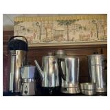 Coffee pots on top of fridge