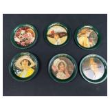 Six small tin Coca Cola plates