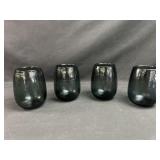 Four black glass cups