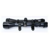 A Pair of Rifle Scopes, including Nichols and Ovli