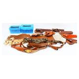 A Collection of Leather Holsters, Belts, and Firea