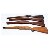 A Group of Four Assorted Rifle Stocks, including