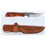 A Fixed Blade Knife with Serrated Spine...