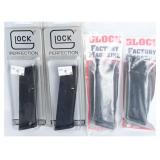 A Group of 4 Glock Factory Magazines