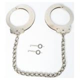 A Pair of Vintage Peerless Handcuff Co. 705C Leg