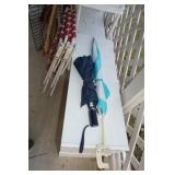 Two Umbrellas and Small Flag