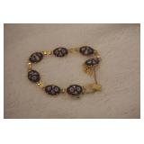 Gold Tone Bracelet w/design