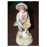 Little Boy Feeding a Goose Figurine