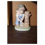 A Little Girl Chopping Down a Stump