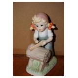 Little Girl Sawing a Log Figurine