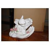Figurine of Praying Hands Holding an Angel
