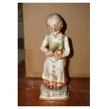 Grandmother Peeling An Apple Figurine