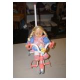 Doll in Tricycle