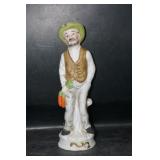 Old Man Holding Carrots Figurine