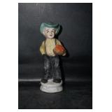 Figurine of a Man Holding a Basket of Apples